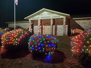 Lillian Masonic Lodge decorated with Christmas lights at night